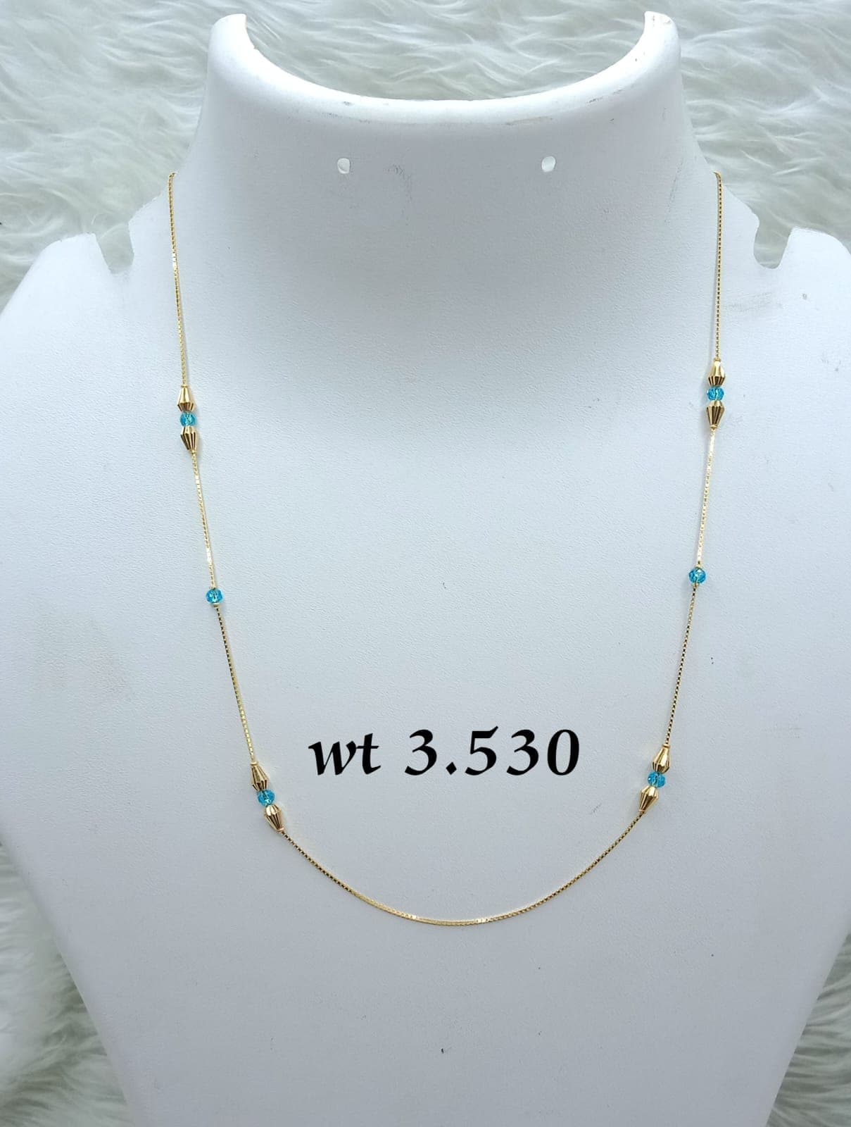 Delicate Gold Chain with Blue Bead Accents